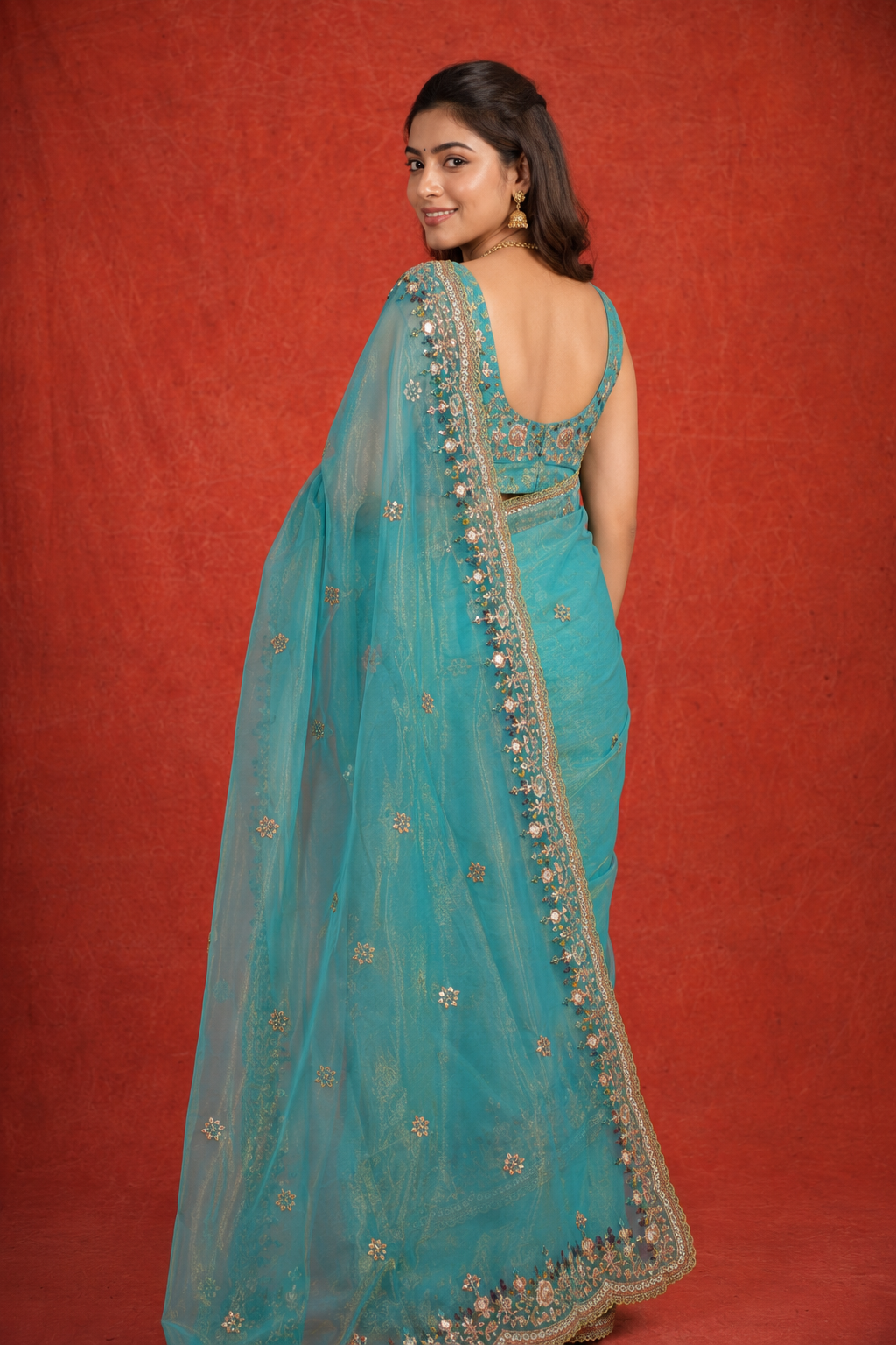 Turquoise Organza Saree with Intricate Zari & Sequin Embroidery