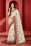 Elegant Ivory Saree with Multicolor Embroidery & Traditional Red Border