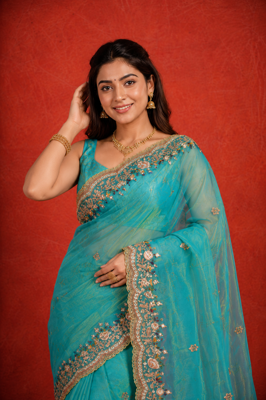 Turquoise Organza Saree with Intricate Zari & Sequin Embroidery