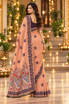 Title: Elegant Peach Saree with Artistic Bird Pallu
