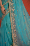 Turquoise Organza Saree with Intricate Zari & Sequin Embroidery
