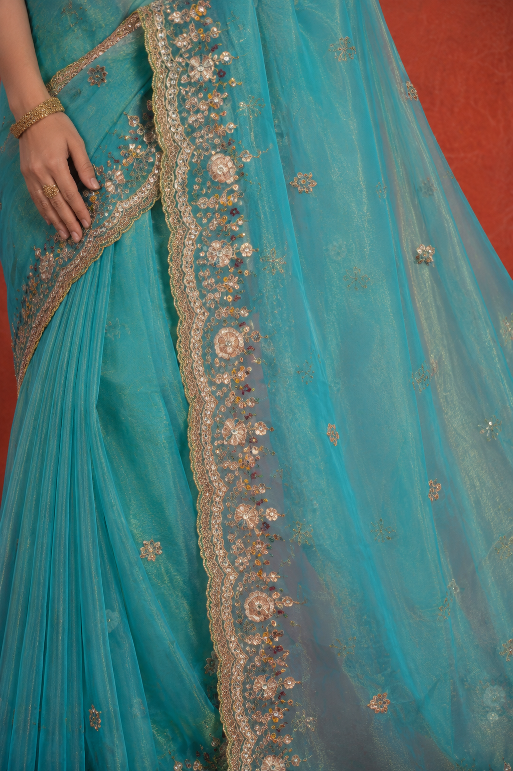 Turquoise Organza Saree with Intricate Zari & Sequin Embroidery