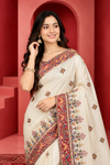Elegant Ivory Saree with Multicolor Embroidery & Traditional Red Border